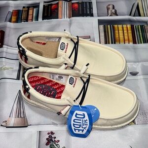 Hey Dude Men's Cream and Navy Loafers with an American Flag Design on the Heel